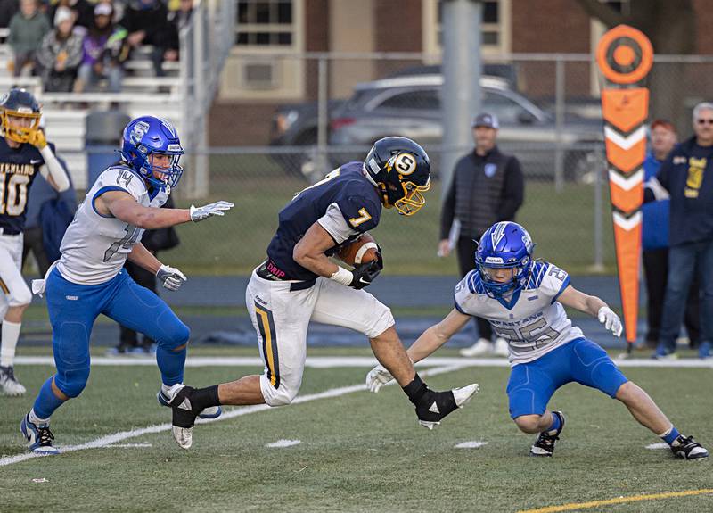 Sterling’s Andre Klaver picks up yards against St. Francis Saturday, Nov. 4, 2023 in a class 5A playoff game in Sterling.