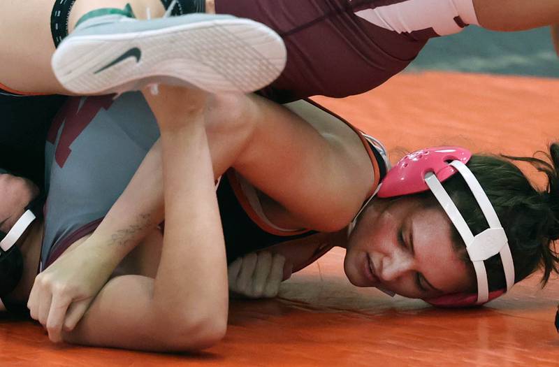 DeKalb’s Reese Zimmer pins Moline’s Isabella Macias-Cervantes Wednesday, Nov. 27, 2024, during their 125 pound match at DeKalb High School.