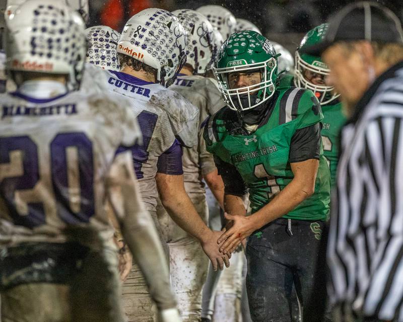 Ethan Othon (1) of Seneca leads team in post game high-five line on Saturday, November 8, 2025 at Seneca High School in Seneca.