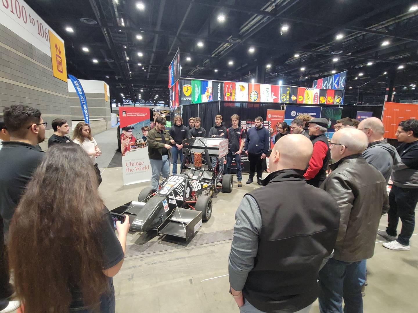 NIU engineering student Livio Letteriello answers technical questions from members of the Society of Automotive Engineers (SAE) regarding the student-built and designed SAE Formula-style race car on Feb. 6, 2026.