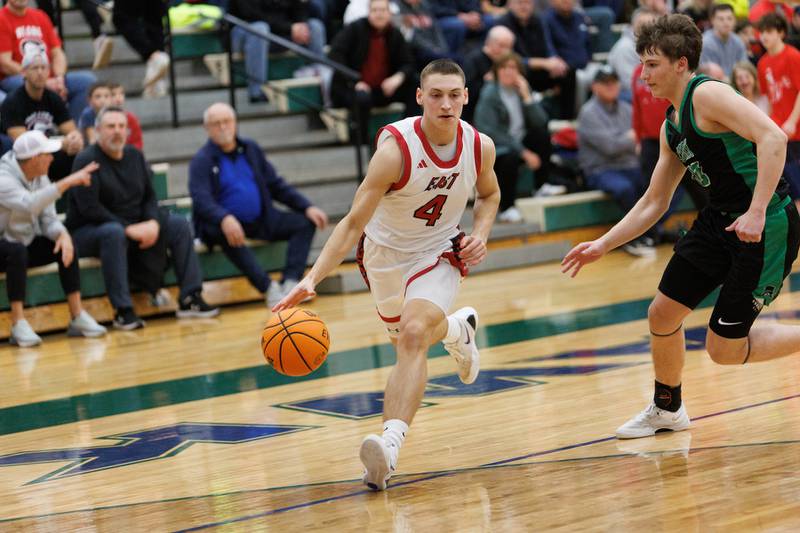 Glenbard East's Michael Nee drives the baseline against York's Will O'Leary at the Class 4A Bartlett Sectional Final on Friday, March 6,2026 in Bartlett.