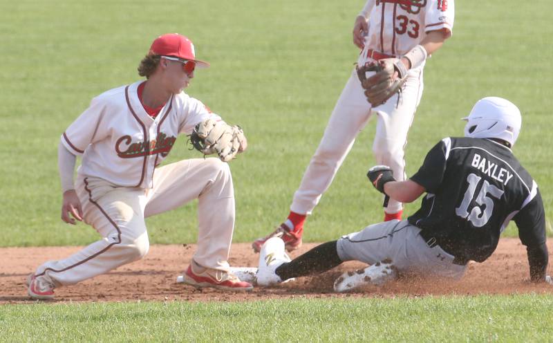 Kaneland's Kanon Baxley slides in safe to second base as L-P's Grey Ernat misses the tag on Tuesday, May 13, 2025 at Huby Sarver Field at the L-P Athletic Complex in La Salle.