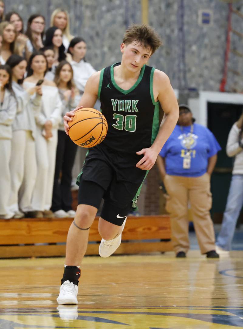 York's Will O'Leary (30) brings the ball down court during a varsity basketball game between York Community and Lyons Township high schools on Friday, Jan. 9, 2026 in La Grange.