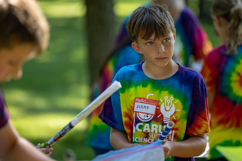 Blake attends cuts paper rocket at the 23rd annual Carus Summer Science Camp on Friday, July 18, 2025 at St. Bede High School in Peru.