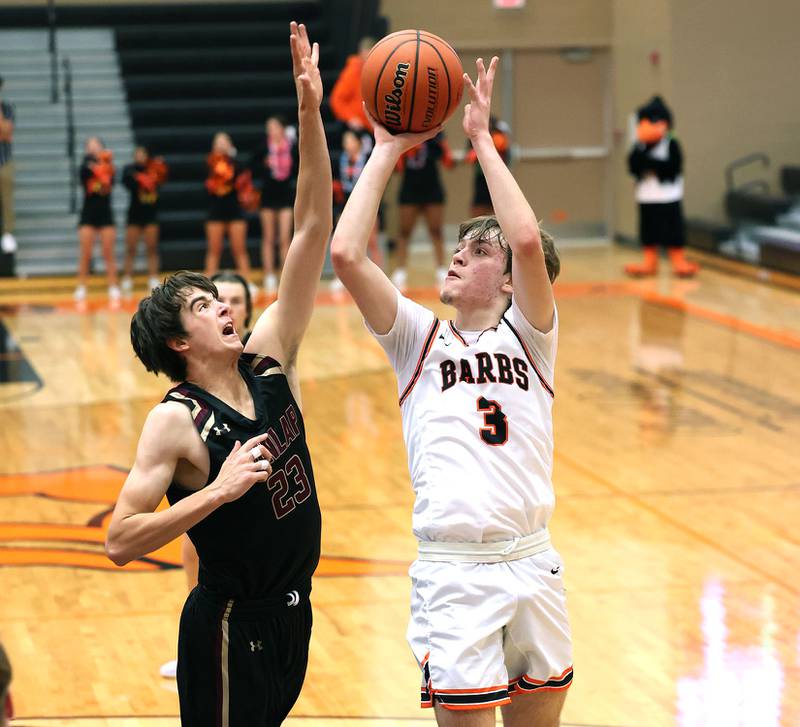 DeKalb's Cooper Phelps shoots over Dunlap's Ryan DiGiallonardo during their game Monday, Nov. 21, 2022, at DeKalb High School.
