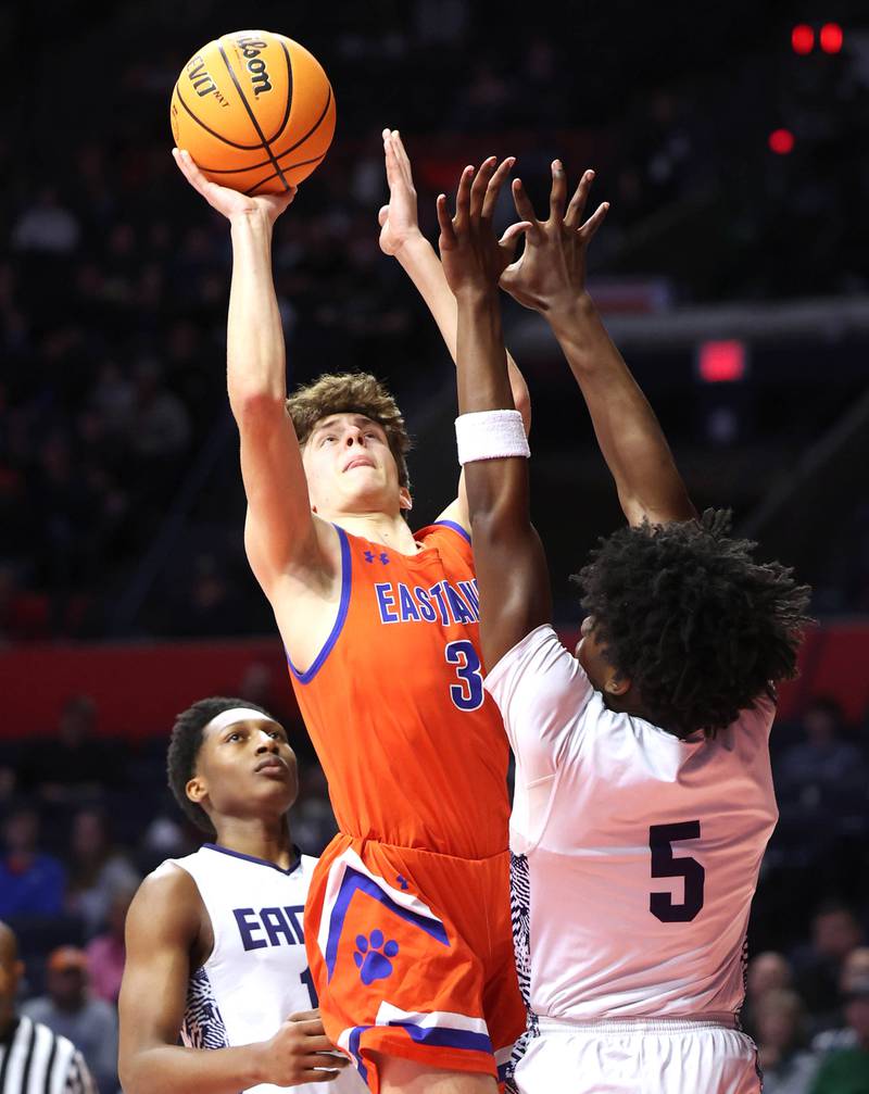 Eastland's Tanner Stern shoots over Chicago Hope Academy's Jaiden Simmons during their IHSA Class 1A state championship game Saturday, March 15, 2025, in the State Farm Center at the University of Illinois in Champaign.