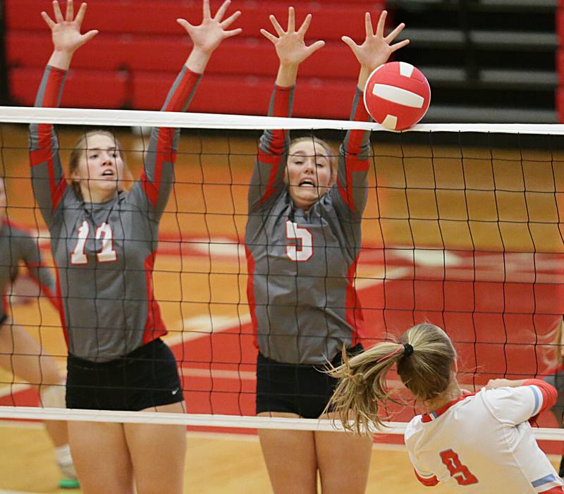 L-P's Olivia Shetterly (17) and teammate Emma Garretson (5) block a spike from Ottawa's Skylar Dorsey (9) on Tuesday, Oct. 18, 2022 at Kingman Gymnasium in Ottawa.
