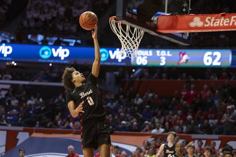 Benet Academy’s Brayden Fagbemi puts in a lay-up against New Trier Friday March 10, 2023 during the 4A IHSA Boys Basketball semifinals.