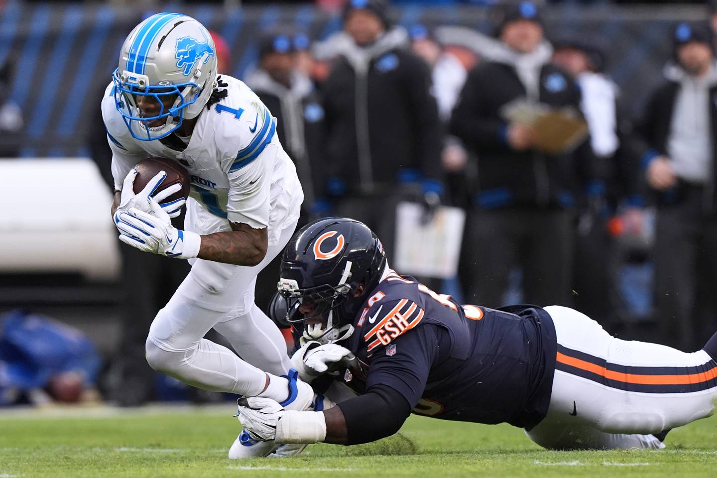 Chicago Bears defensive end Grady Jarrett, right, tackles Detroit Lions wide receiver Jameson Williams during the first half of an NFL football game in Chicago, Sunday, Jan. 4, 2026. (AP Photo/Nam Y. Huh)
