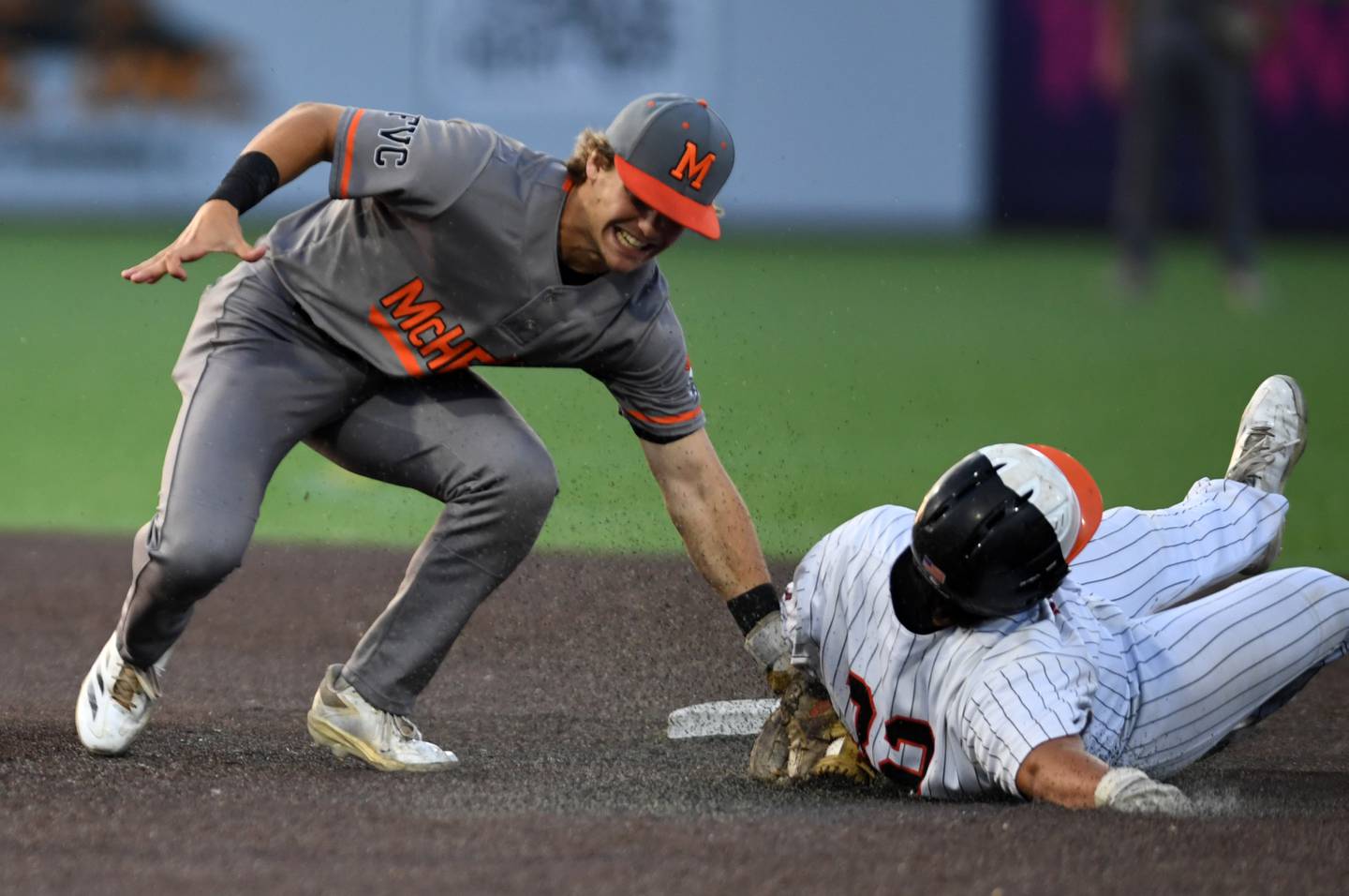 Libertyville’s Carson Holmes gets tagged out by McHenry's Kyle Maness at second base during the Class 4A state baseball title game at Slammers Stadium on Saturday, June 14, 2025 in Joliet.