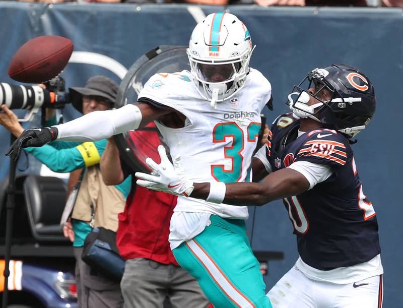 Miami Dolphins cornerback Isaiah Johnson knocks the ball away from Chicago Bears wide receiver Jahdae Walker on a fourth down play with under two minutes remaining in the game Sunday, Aug. 10, 2025, during their game at Soldier Field in Chicago.