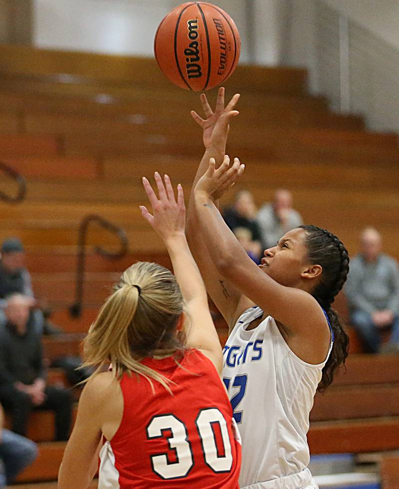 Princeton's Mariah Hobson (12) shoots a shot over Streator's Marisa Vickers (30) in the Lady Tigers Holiday Tournament on Tuesday, Nov. 15, 2022 in Princeton.