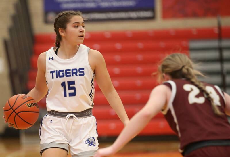 Princeton's Olivia Mattingly looks to pass the ball while being guarded by Morris's Makenna Boyle during the Lady Pirate Holiday Tournament on Wednesday, Dec. 20, 2023 in Kingman Gym.