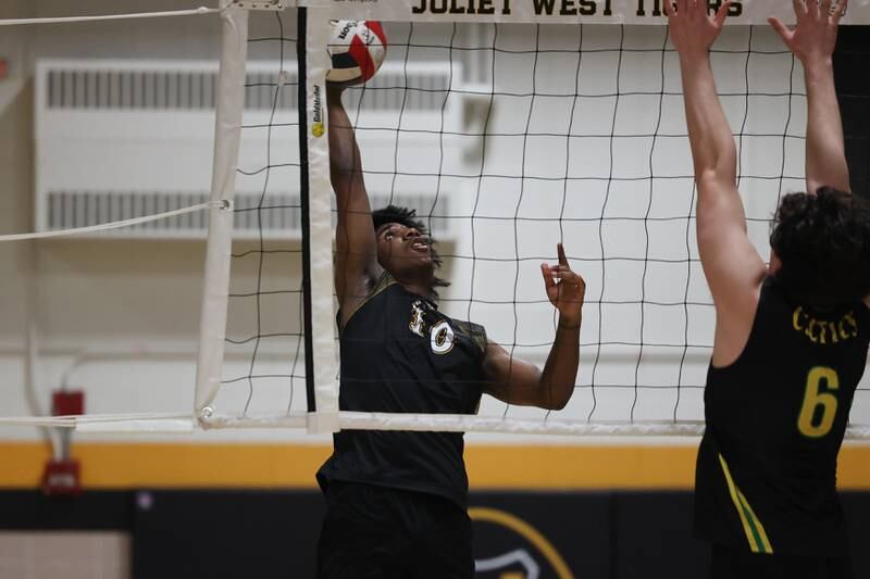 Joliet West’s Adrian Paul stretches for the shot against Providence on Thursday, March 23, 2023 in Joliet.