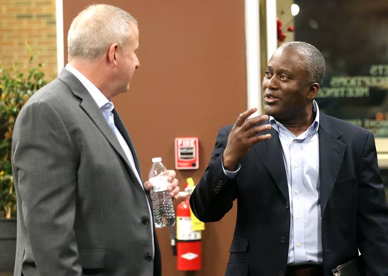 Current DeKalb Mayor Cohen Barnes, (left) who is running for re-election, talks to one of his opponents in the race for mayor Kouame M. Sanan Wednesday, Feb. 19, 2025, at the DeKalb Area Rental Association and DeKalb Area Builders Association Candidate Night at Faranda's Banquet Center in DeKalb. Other candidates vying for the DeKalb mayor position in April are current 7th Ward Alderman John. B. Walker and Linh Nguyen.