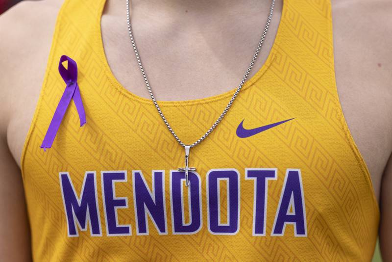 Robert Botello wears a remembrance ribbon in honor of Madrick Musgrove during the Rollie Morris Invite on April 19, 2025 at Hall High School.