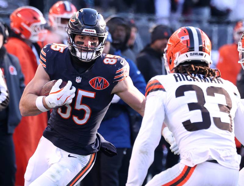 Chicago Bears tight end Cole Kmet looks to get by Cleveland Browns safety Ronnie Hickman during their game Sunday, Dec. 14, 2025, at Soldier Field in Chicago.