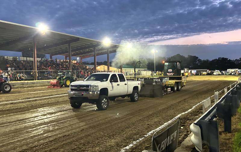 Riley Logan of Oregon drives his 2013 truck in one of the divisions at the Illini Truck & Tractor Pulls at the Ogle County Fair on Thursday, Aug. 1, 2024.