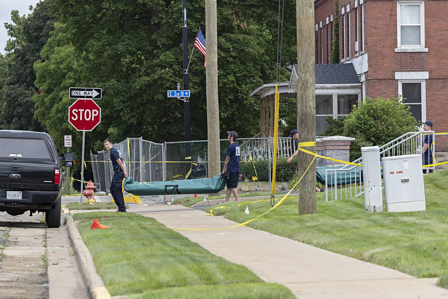 Equipment is being removed by Sterling firefighters Thursday, July 13, 2023 from the scene of an apartment building fire that happened last week.