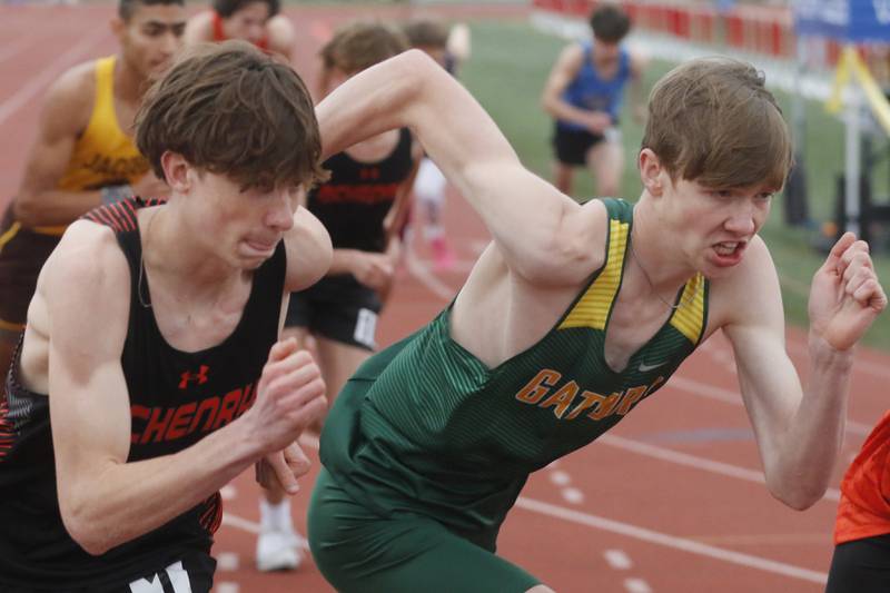 McHenry’s Doug Martin and Crystal Lake South’s Adam Strombom battle for track position as the start of the 800 meter run during the Fox Valley Conference Boys Track and Field Meet on Thursday, May 9, 2024, at Huntley High School.