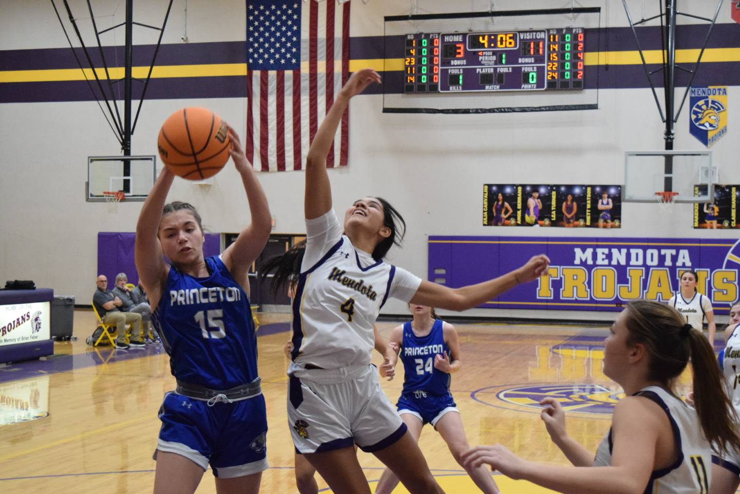 Princeton's Olivia Mattingly pulls down a rebound over Mendota's Crystal Garcia at Mendota on Thursday. She scored 11 points in the Tigresses' 65-28 win.