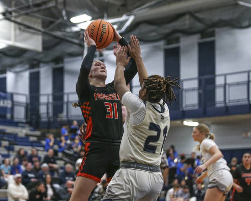 Minooka's Madelyn Kiper (31) draws a foul on a shot attempt during their basketball game between Minooka at Oswego East Friday, Jan 16, 2026 in Oswego.
