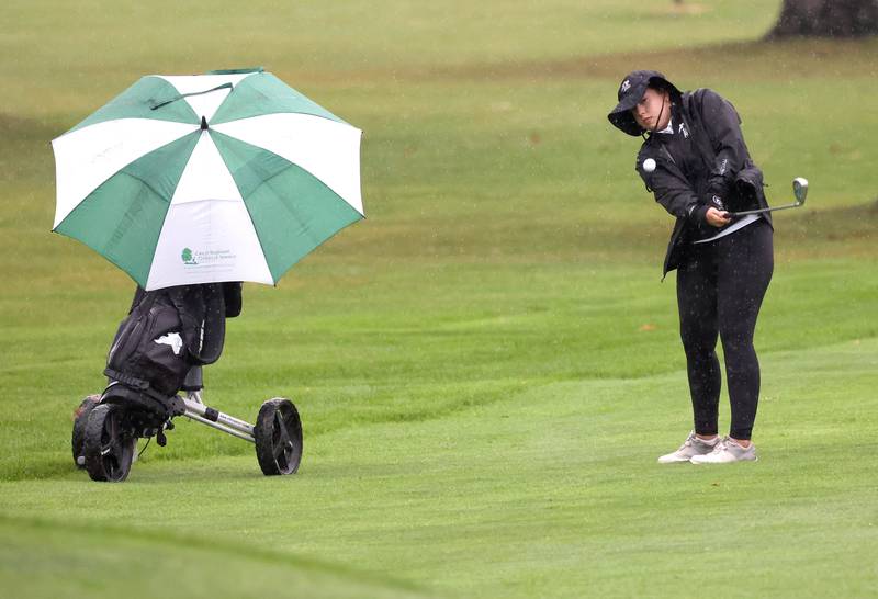 Kaneland’s Brighton Davoust hits from the fairway on the second hole Tuesday, Sept. 24, 2024, during the Interstate 8 girls golf tournament at the Sycamore Golf Club.