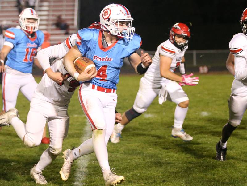 Ottawa's Logan Mills carries the ball on Friday, Oct. 24, 2025 on Kingman Field at Ottawa High School.