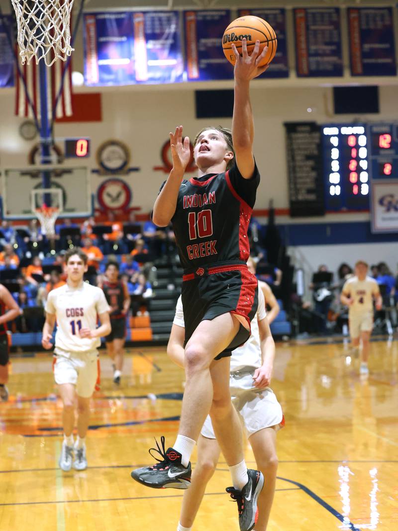 Indian Creek's Parker Murry gets a layup in front of a Genoa-Kingston defender during their game Friday, Jan. 2, 2026, at Genoa Kingston High School.