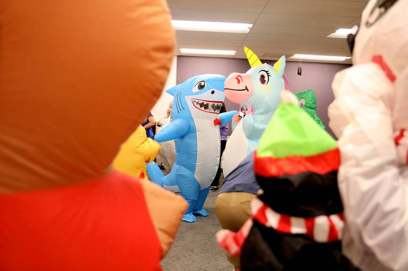 Teachers and staff members dress in their inflatable costumes to surprise students at Emily G Johns Elementary School in Plano with an inflatables race on Tuesday, May 27. 2025 after the all-school field day to celebrate the end of the school year.