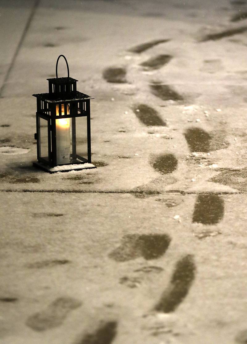 Footsteps in the snow during Crystal Lake's Luminary Nights on Thursday, Dec. 19, 2024, in downtown Crystal Lake. The snowy night featured sidewalks lite luminaries, holiday shopping and a visit to the Santa House.