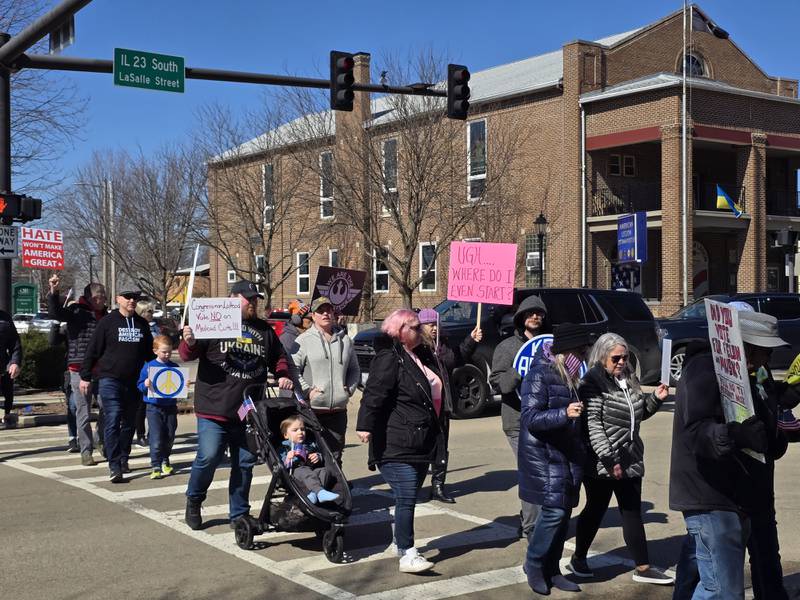 Several residents participated in a march Saturday, March 5, 2025, from Bold and Curvy Boutique on Madison Street to Washington Square in Ottawa to speak out against actions from the Trump administration.