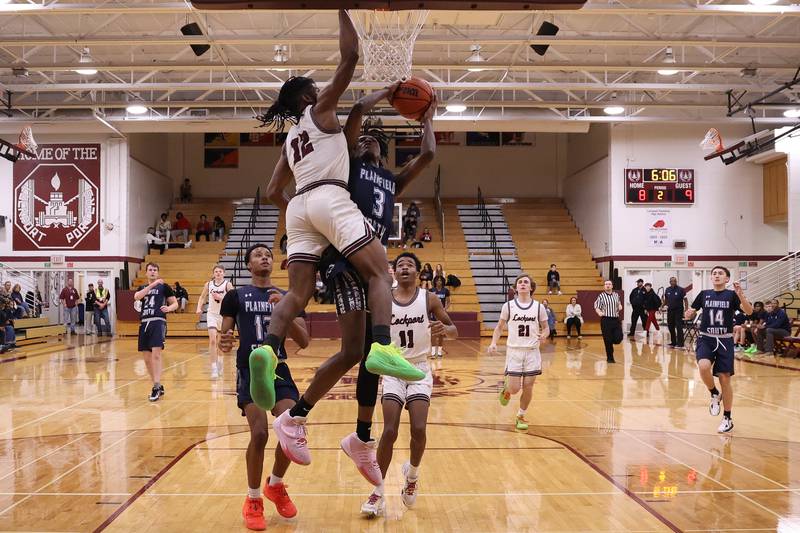 Plainfield South’s Jermaine Theodore draws the foul going for the basket against Lockport on Wednesday January 25th, 2023.