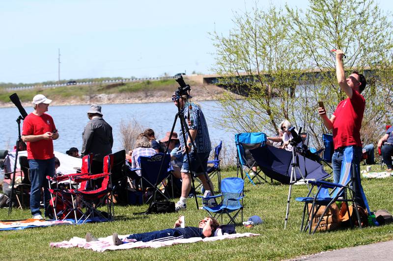 People view the total solar eclipse from Rend Lake near Whittington on Monday, April 8, 2024.