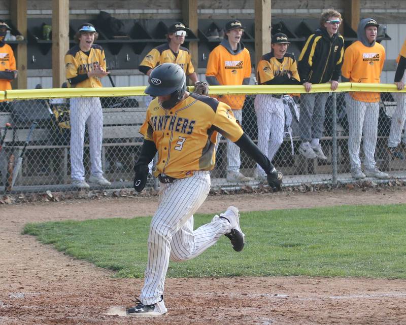 Putnam County's Nicholas Currie scores the teams first run against Henry-Senachwine on Tuesday, April 25, 2023 at Putnam County High School.