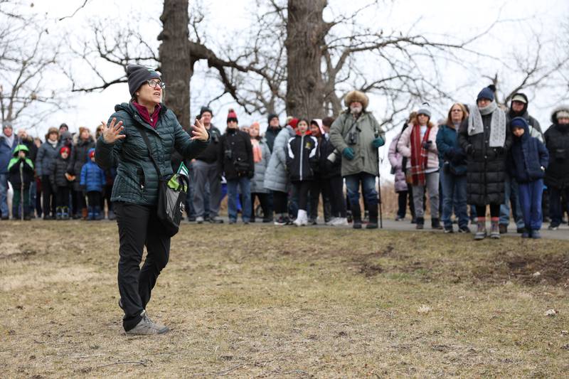 A group of over fifty people listen to a Forest Preserve District staff member on an interactive hiking tour at the Four Rivers Environmental Education Center’s annual Eagle Watch program in Channahon.