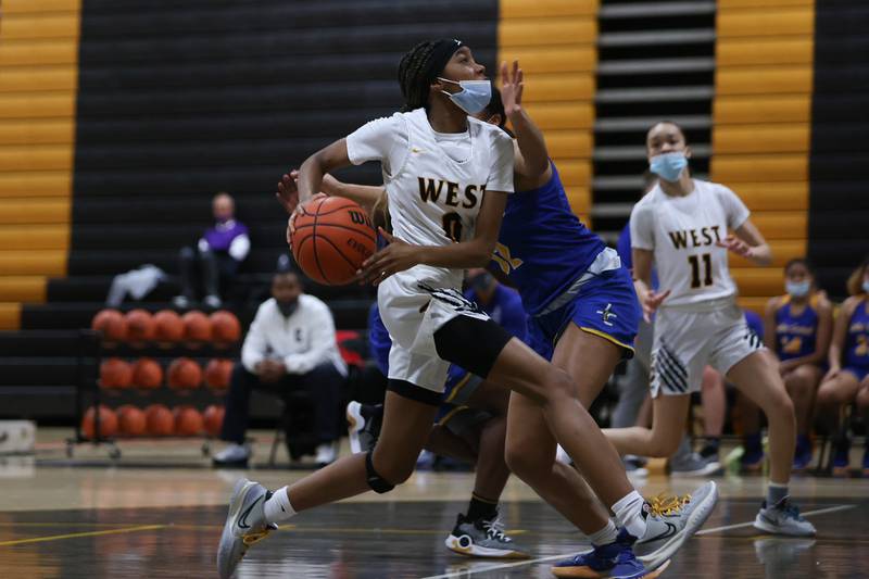 Joliet West’s Lisa Thompson drives to the basket against Joliet Central in the Class 4A Moline Regional semifinal. Tuesday, Feb. 15, 2022, in Joliet.