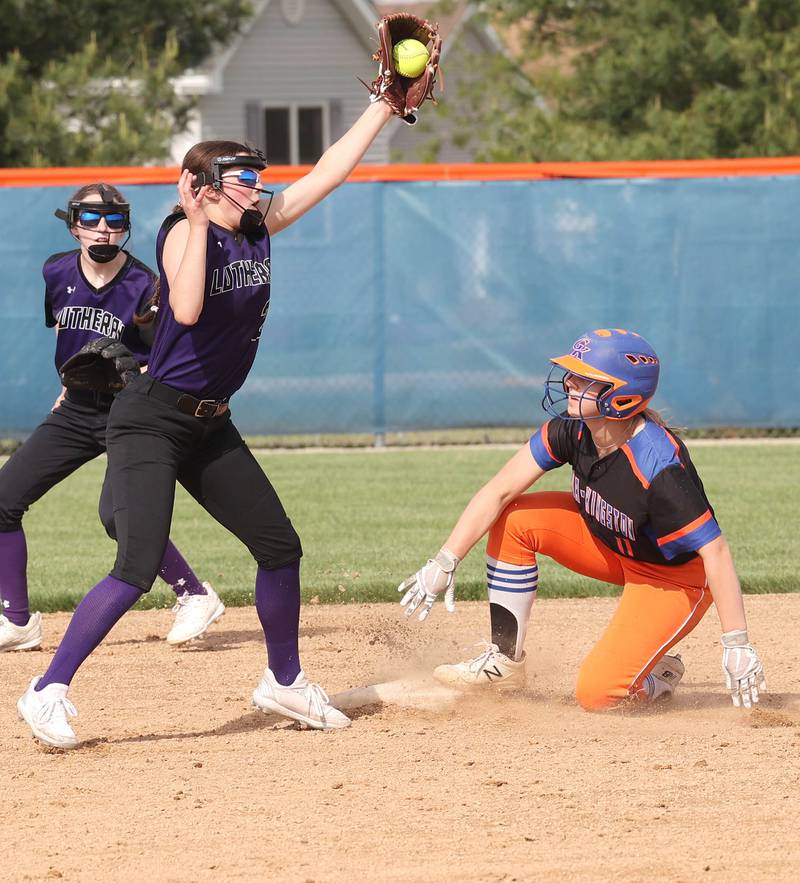 Genoa-Kingston's Emily Trzynka slides in safely with a stolen base as Rockford Lutheran's Reese Landin takes the throw during their Class 2A Regional quarter final game Monday, May 15, 2023, at Genoa-Kingston High School.