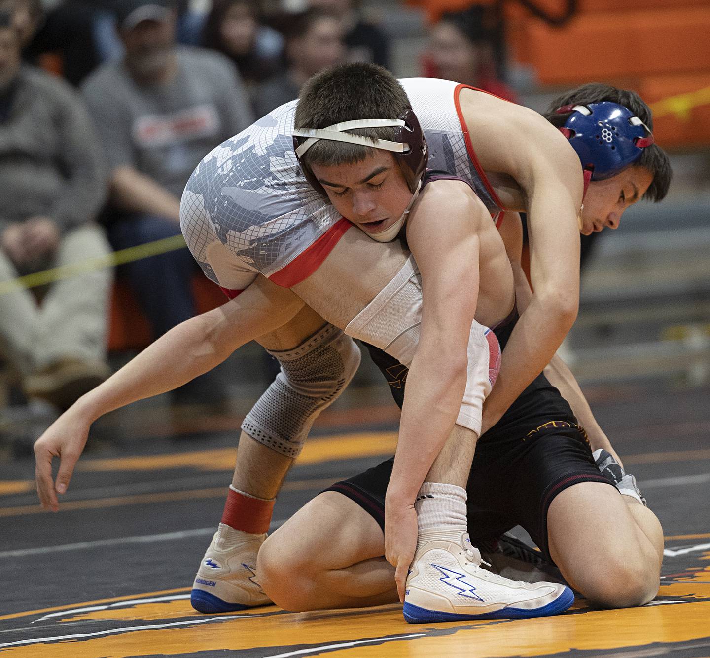 Oregon’s Isaiah Perez works on Richmond-Burton’s Lelan Nelson in the 126 pound third place match Saturday, Feb. 14, 2026, during the Class 1A wrestling sectionals in Byron.