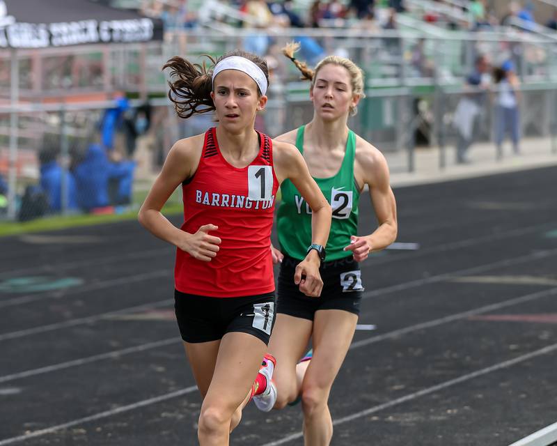 Barrington's Scout Storms and York's Karelyn Winton finish 1s and 2nd in heat 2 of the 3200 meter run at the Glenbard West Sue Pariseau Girls Track and Field Invitational.  April 23.2022.