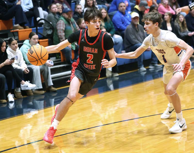 Indian Creek's Jason Brewer goes baseline against Genoa-Kingston's Kash Sunderlage during their game Friday, Jan. 2, 2026, at Genoa Kingston High School.