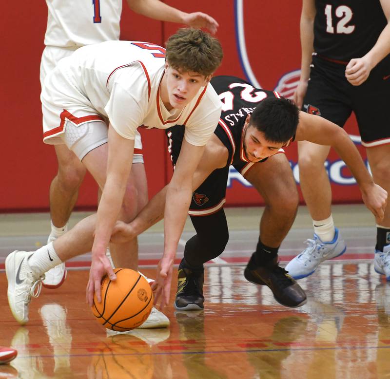 Oregon's Tucker O'Brien (left) and Forreston's Mickey Probst battle for a loose ball on Tuesday, Feb. 17, 2026 at the Blackhawk Center in Oregon.