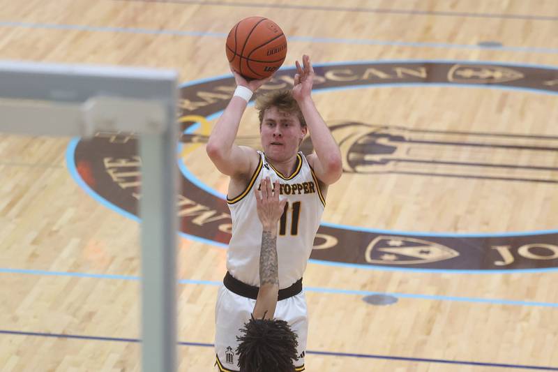 Joliet Catholic’s Drew Wills puts up an outside shot against Plainfield South on Wednesday, Jan. 17th, 2024 in Joliet.