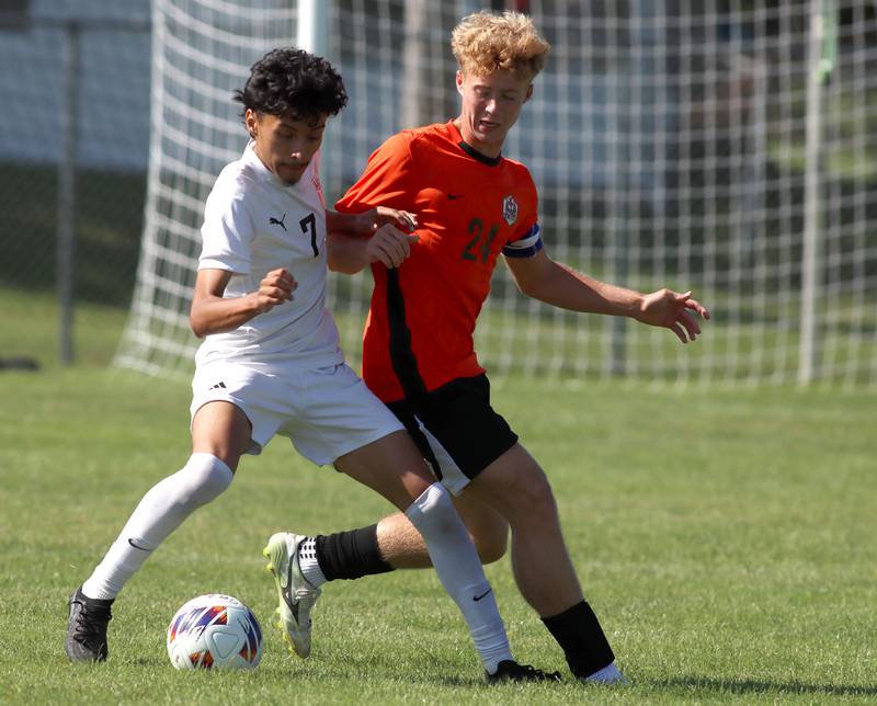 Crystal Lake Central’s Gavin Kane, right, battles Harvard’s Jesus Aquino in varsity boys soccer at Crystal Lake Central High School in Crystal Lake on Saturday, Sept. 6, 2025.