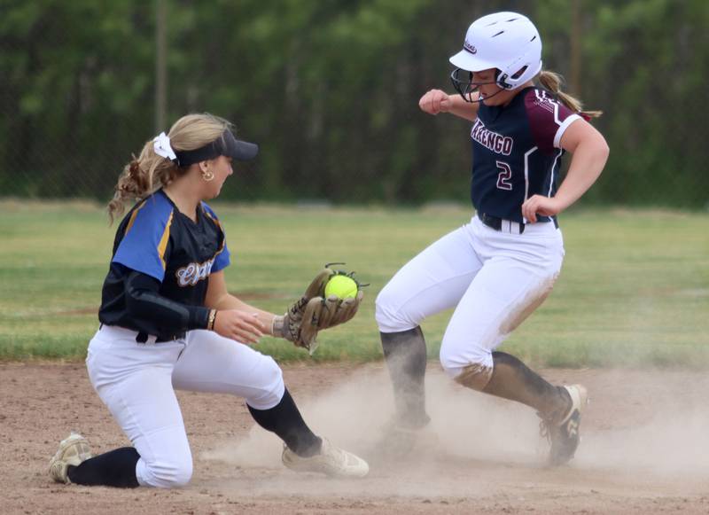 Marengo’s Ellie White pulls in safely to second base as Aurora Central Catholic’s Morgan Vaghy, left, fields the throw  in varsity girls softball IHSA Class 2A Regional Title Game action on Friday, May 22, 2026 at Raymond Benoy Field on the campus of Marian Central High School in Woodstock.