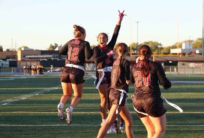 Yorkville's Bella Esquivel, center, leaps in celebration of the extra point scored by Annabel West, left, during the Foxes' 26-13 victory over Kankakee on Tuesday, Oct. 7, 2025.