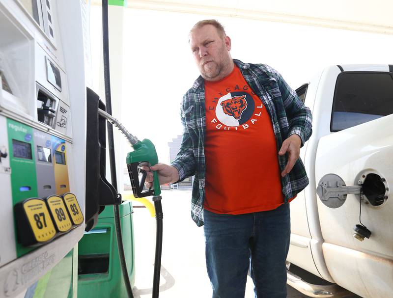 George Hebel of Peru, fills up his pickup truck at Beck's gas station on Thursday March 17, 2022 in La Salle.