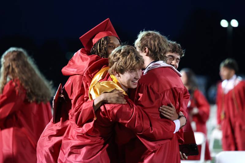 Graduates rush to celebrate with each other on the field following the Bradley-Bourbonnais Community High School commencement ceremony on Thursday, May 21, 2026.