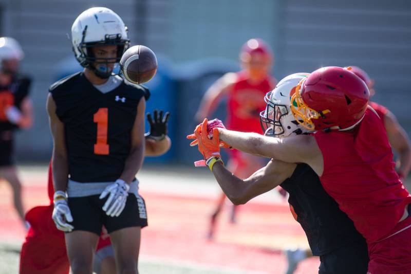 Players from Batavia and Plainfield East High School go for the ball at at Batavia High School's 7 on 7 tournament on Thursday, July 14, 2022.