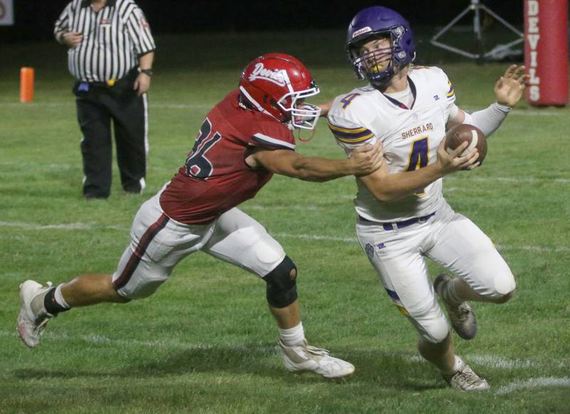 Hall's Jonathon Stunkel chases down Sherrard quarterback Carter Brown on Friday, Sept. 19, 2025 at Richard Nesti Stadium.
